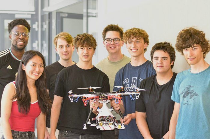 CEEE students with the six members of the makeathon team that built a drone. The students in the middle are holding the drone.