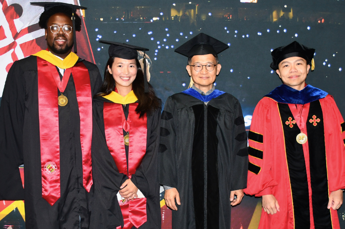 CEEE graduates at Clark School 2026 Commencement at the Xfinity center. Graduates and faculty are dressed in academic regalia.