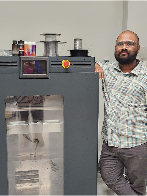 graduate student with 3D printer